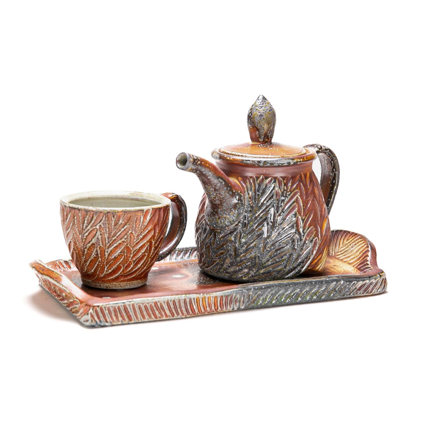 Carved Tea Pot, Cup and Tray Set
